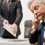 Indifferent employer expressing apathy in the office