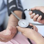 doctor-taking-patient-s-blood-pressure