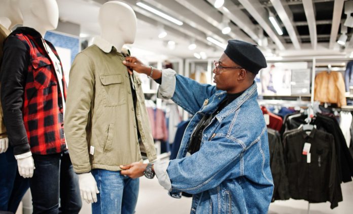 stylish-casual-african-american-man-jeans-jacket-black-beret-clothes-store-looking-new-jacket-mannequin