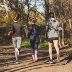 rear-view-people-running-park