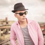relaxed-young-man-with-hat-and-sunglasses
